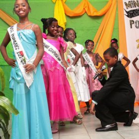 Anthony Minott/Freelance Photographer
Contestants are being serenaded by 11 year old Adrian Adams during a Mini Miss Portmore 2010 grand coronation show at the Portmore HEART Academy on Saturday, May 22, 2010.