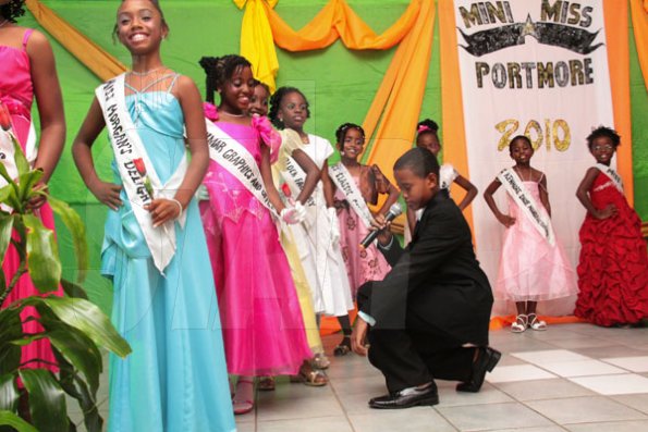 Anthony Minott/Freelance Photographer
Contestants are being serenaded by 11 year old Adrian Adams during a Mini Miss Portmore 2010 grand coronation show at the Portmore HEART Academy on Saturday, May 22, 2010.
