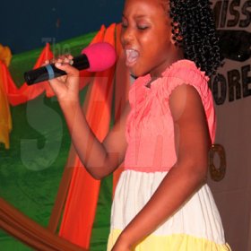 Anthony Minott/Freelance Photographer
Third place, contestant, Donique Smith (Miss Personally Yours) sings the spiritual rendition 'Four days late', during a Mini Miss Portmore 2010 grand coronation show at the Portmore HEART Academy on Saturday, May 22, 2010.