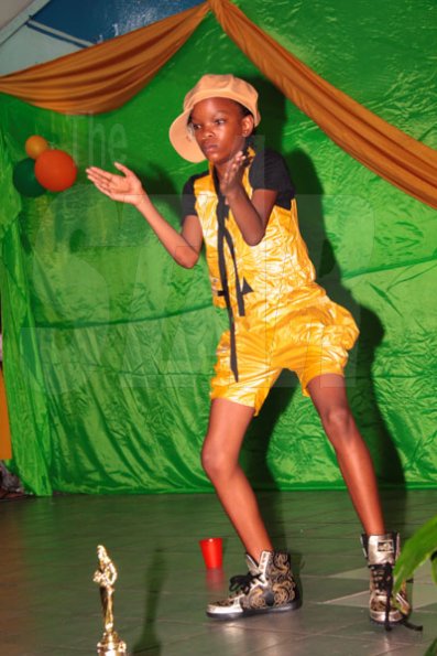 Anthony Minott/Freelance Photographer
Annisa Murray performs to dancehall tunes during a Mini Miss Portmore 2010 grand coronation show at the Portmore HEART Academy on Saturday, May 22, 2010.