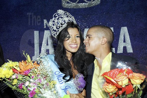 Winston Sill / Freelance Photographer
Adriene Lemaire couldn't wait to plant one onthe cheeks of his lady love Danielle Crosskill after she was crowned Miss Jamiaca World 2011.



Miss Jamaica world.
