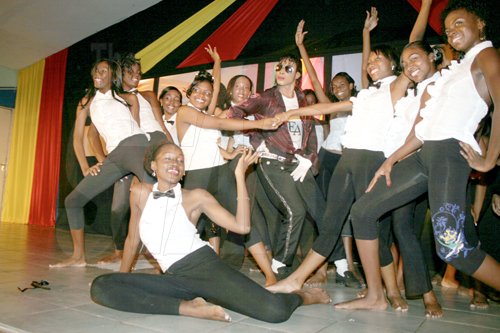 Anthony Minott/Freelance Photographer
Jamaica's Michael Jackson, Nixon Hall (centre), pose with contestants in the Miss Teen Portmore pageant during the opening act.