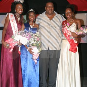 Anthony Minott/Freelance Photographer
Mayor of Portmore, Keith Hinds (second right), pose with three beauties, from left, the new Miss Teen Portmore for 2009, Michelle Cole, sashed by Ken's Wildflower, Christeen Marshall, Miss NF Barnes Construction, and  Anushka Gaynor, Miss Portmore Gas Distributors after the Burger King/Jamaica Money Market Brokers (JMMB), Miss Teen Portmore pageant at the Portmore HEART Academy on Sunday.