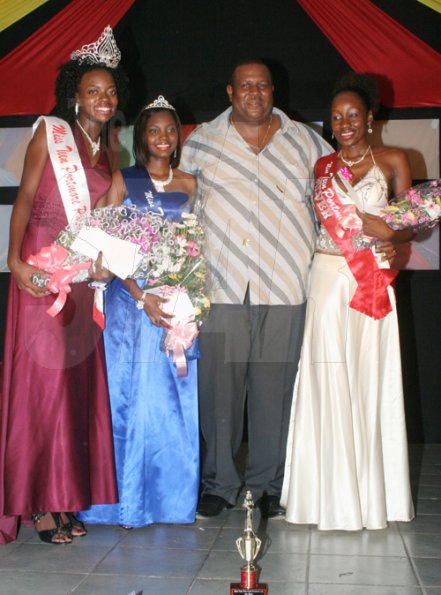 Anthony Minott/Freelance Photographer
Mayor of Portmore, Keith Hinds (second right), pose with three beauties, from left, the new Miss Teen Portmore for 2009, Michelle Cole, sashed by Ken's Wildflower, Christeen Marshall, Miss NF Barnes Construction, and  Anushka Gaynor, Miss Portmore Gas Distributors after the Burger King/Jamaica Money Market Brokers (JMMB), Miss Teen Portmore pageant at the Portmore HEART Academy on Sunday.