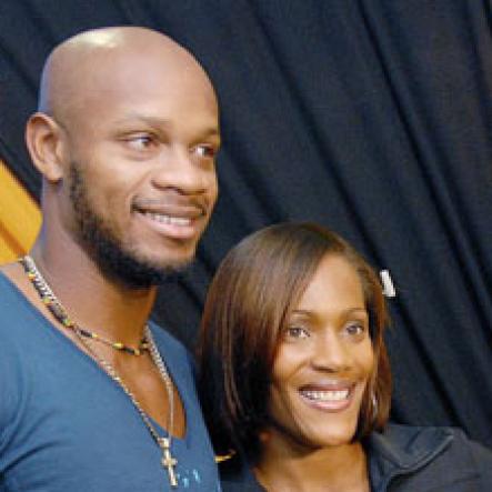 Pic 3
World 100 metres bronze medalist, Asafa Powell (left), world 100 metres hurdles champion Brigitte Foster-Hylton (centre) and 400 metres silver medalist, Shericka Williams, pose  for the camera in the VIP lounge at the Norman Manley International Airport,Kingston, Saturday (September 26). A press conference and a reception were held in the lounge  to welcome the athletes from the World Championships in Athletics in Berlin, Germany.