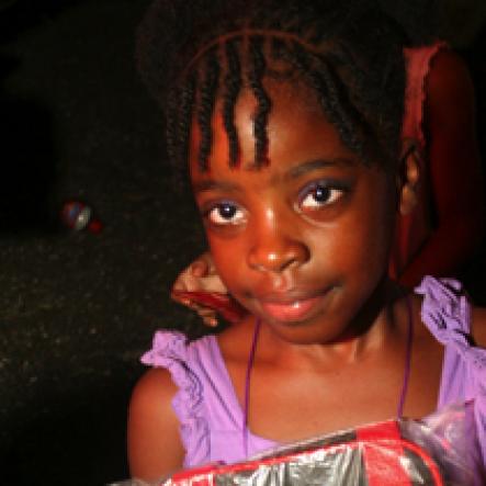 Anthony Minott/Freelance Photographer
Scenes during a Munga/Digicel back to school treat at Queens Borough, playfield, near Ackee Walk, in St Andrew recently.