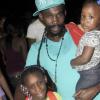 Anthony Minott/Freelance PhotographerMunga Honoureble with daughters,  Jahsenica Rhoden (left), and his  Thalia Rhoden during a Munga/Digicel back to school treat at Queens Borough, playfield, near Ackee W alk, in St Andrew recently.