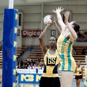 Winston Sill / Freelance Photographer
Jamaica's Romelda Aiken shoots over Australia's goal keeper Susan Fuhrmann during the opening game of their two-Test Sunshine Series at the National Indoor Sports Centre yesterday. Australia won 53-51.






Sunshine Series netball match between Jamaica and Australia, played at the National Indoor Sports Centre (NISC), Stadium Complex on Saturday October 17, 2009.