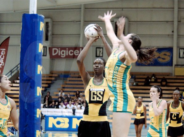 Winston Sill / Freelance Photographer
Jamaica's Romelda Aiken shoots over Australia's goal keeper Susan Fuhrmann during the opening game of their two-Test Sunshine Series at the National Indoor Sports Centre yesterday. Australia won 53-51.






Sunshine Series netball match between Jamaica and Australia, played at the National Indoor Sports Centre (NISC), Stadium Complex on Saturday October 17, 2009.