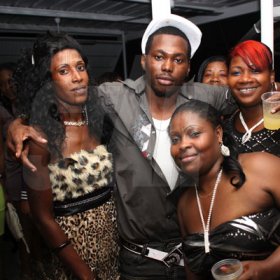 Anthony Minott/Freelance Photographer
A group of friends pose for a photo opt during a Bailey's New Year's Eve party atop the roof of Ken's Wildflower, Bayside, Portmore.