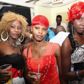 Anthony Minott/Freelance Photographer
These ladies went for colourful hairstyles as they seek the lime light during a Bailey's New Year's Eve party atop the roof of Ken's Wildflower, Bayside, Portmore.