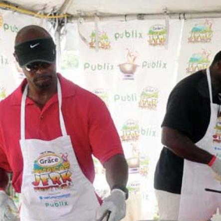 Keisha Shakespeare
Fomer NFL player for the Dolphins, Kerry Glenn (left) is challenging his buddy, retired NFL player for the Lions, Bennie Blades to a show down in the kitchen as oppose to on the field at the Celebrity Quick Fire Cook-off held during the Grace Jamaican Jerk Festival.
