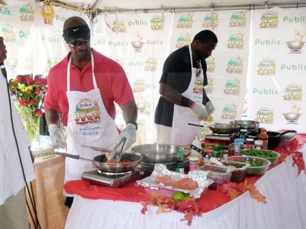 Keisha Shakespeare
Fomer NFL player for the Dolphins, Kerry Glenn (left) is challenging his buddy, retired NFL player for the Lions, Bennie Blades to a show down in the kitchen as oppose to on the field at the Celebrity Quick Fire Cook-off held during the Grace Jamaican Jerk Festival.