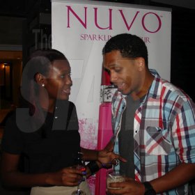 Contributed
NUVO - Nuvo Brand Manager, Safia Cooper jives DJ Bambino during the Face Place's grand opening on Carvalho Drive on Wednesday March 2.