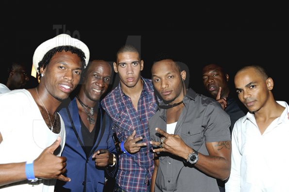 Winston Sill / Freelance Photographer

Osmosis' Philip "PP" Palmer (second left) and pals Scott Dunn (right) kicking it with English footballers Daniel Sturridge from Chelsea F.A.(left), Chris Smalling (centre ) from Manchester United and  local artistes, Craig "Leftside" Parks (second right) and Leon Stuuridge at Osmosis, Fort Charles, Port Royal on Saturday, July 2.  
********************************************************
Osmosis Party, held at Fort Charles, Port Royal on Saturday night July 2, 2011.