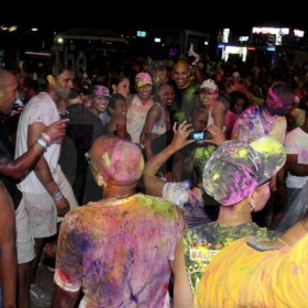 Winston Sill / Freelance Photographer
Coloured powder finds its way on the clothes of everybody at Pandemonium,  The Carnival Experience,  at The Golf Academy, New Kingston on Friday night.








 April 5, 2013.