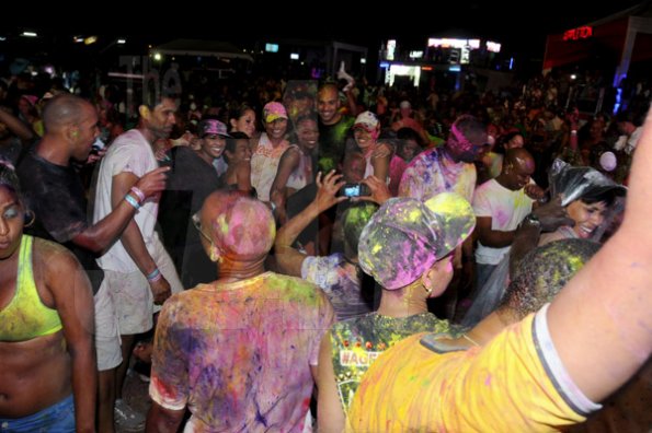 Winston Sill / Freelance Photographer
Coloured powder finds its way on the clothes of everybody at Pandemonium,  The Carnival Experience,  at The Golf Academy, New Kingston on Friday night.








 April 5, 2013.