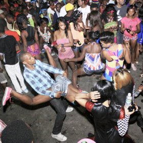 Anthony Minott/Freelance Photographer 
There was high drama inside a section of the crowd as some patrons went wild during Pon Di Spot Fridayz held at Headley Avenue, Drewsland last Friday. The event is held every two weeks.
