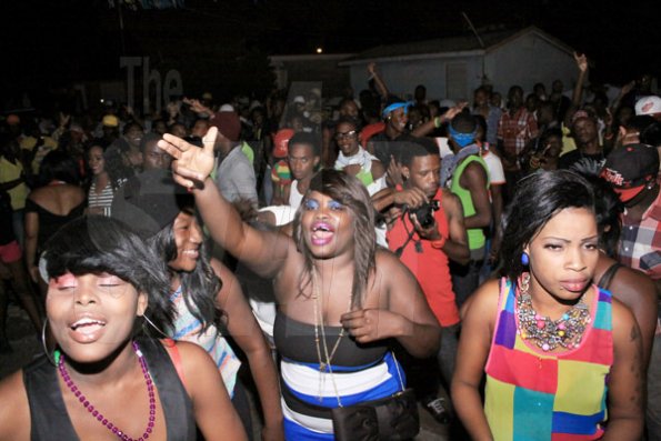 Anthony Minott/Freelance Photographer 
Bust a blank!!! A patron shows her approval during Pon Di Spot Fridayz held at Headley Avenue, Drewsland last Friday. The event is held every two weeks.
