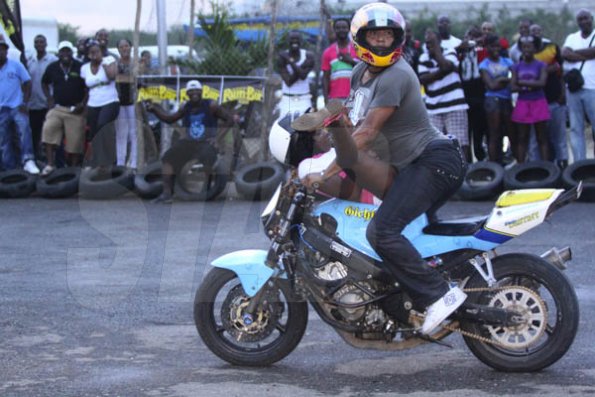 Anthony Minott/Freelance Photographer 
RIDING UNDER THE INFLUENCE? Veteran biker Ramond Gichie gets wild during a Portmore Bike show dubbed: clutch control at Stone's Jerk hut and Lounge, across from Newlands, Portmore St Catherine, Ash Wednesday, March 9, 2011.