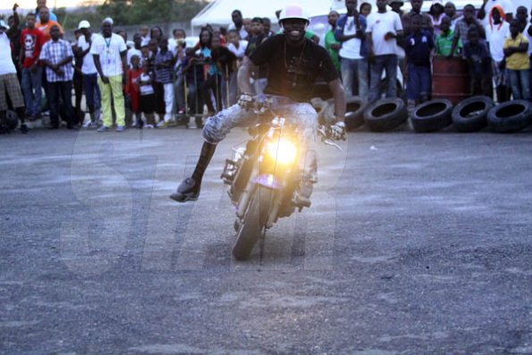 Anthony Minott/Freelance Photographer 
One foot Charles, sporting an atrificial leg was a crowd favourite during a Portmore Bike show dubbed: clutch control at Stone's Jerk hut and Lounge, across from Newlands, Portmore St Catherine, Ash Wednesday, March 9, 2011.