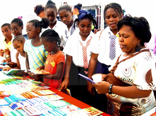 Peta-Gaye Clachar/Freelance Photographer
Students and children from all over browse through some books while at the Jamaica Library Service National Reading Fair at the Kingston and St. Andrew Parish Library on Saturday, November 28, 2009.