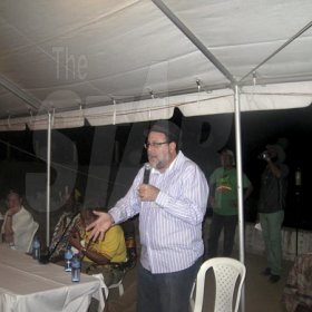 Mel Cooke<\n>Justice Minister, Senator Mark Golding, speaks at the Herb Curb on Saturday night at Rebel Salute 2oig, held at Grizzly's Plantation Cove, Priory, St Ann.