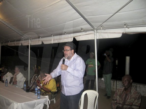 Mel Cooke<\n>Justice Minister, Senator Mark Golding, speaks at the Herb Curb on Saturday night at Rebel Salute 2oig, held at Grizzly's Plantation Cove, Priory, St Ann.