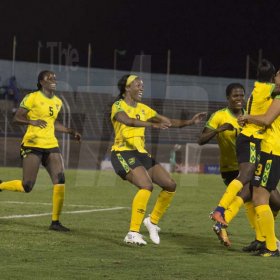 Marol Sweatman (right) of the Reggae Girlz  celebrates goal scored with teammates in the International Womens friendly against Chile held at the National stadium on Thursday February 28, 2019