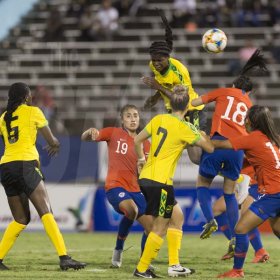 Jamaica's Khadija Shaw goes airborne to head the ball from a corner kick in international Women's friendly agains Chile at the national stadium on Thursday February 28, 2019.
