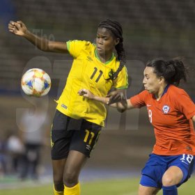 Gladstone Taylor/Multimedia Photo EditorJamaicas Khadija Shaw in a tussle with Chile's Camila Sáez (right) for possession of the ballin the Womens international friendly held at the national stadium on Thursday February 28, 2019.Reggae Girlz