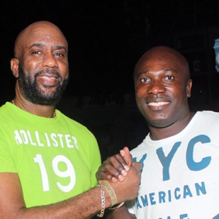 Anthony Minott/Freelance Photographer
Johno (right), the Unleashed Entertainment Boss, share lens time with a friend during Unleashed Entertainment's 'Reggae Luau' Beach Party held at Pearly Beach, Ocho  Rios, St Ann last Sunday.