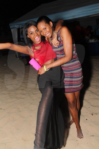 Anthony Minott/Freelance Photographer
Yes! She's quite excited about being pictured with a friend during Unleashed Entertainment's 'Reggae Luau' Beach Party held at Pearly Beach, Ocho  Rios, St Ann last Sunday.