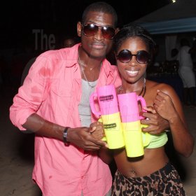 Anthony Minott/Freelance Photographer
Friends share the limelight during Unleashed Entertainment's 'Reggae Luau' Beach Party held at Pearly Beach, Ocho  Rios, St Ann last Sunday.