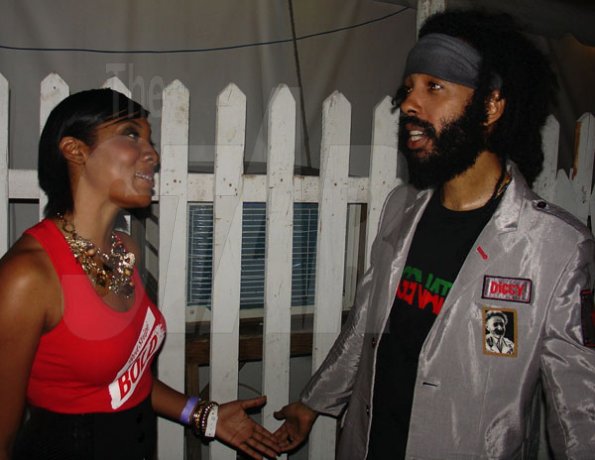 Contributed
Renee Wong Assistant Brand Manager Red Stripe chats with entertainer Protege during Reggae Sumfest International night 2 in Catherine Hall Montego Bay on Saturday July 23.