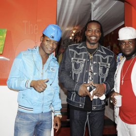 Photo by Sheena Gayle
Magnum Kings and Queens  runner up, Specialist (left), along with renowned cricketer Chris Gayle and Magnum King winner Hurricane hang out at the Digicel booth at Reggae Sumfest on Thursday night.