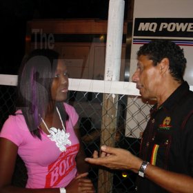 Contributed
Sumfest - Safia Cooper, Brand Manager for Red Stripe chats with Johnny Gourzong of Summerfest Productions during dancehall night Thursday July 21 at Reggae Sumfest in Catherine Hal Montego Bay.