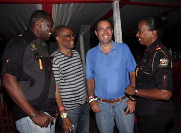 Contributed
Reggae Sumfest - A culture yard discussion perhaps. Here Minister of Information, Honourable Daryl Vaz (second right) catches up with Mayor of Montego Bay, Charles Sinclair (second left) and  the Digicel team of Dwayne Bennett (left) and Head of Business Sales – West, Joy Clarke (right).