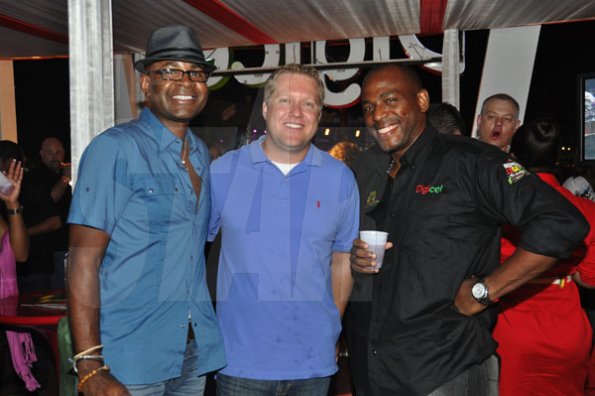 Janet Silvera/Staff Reporter
Sumfest - Ritz Carlton Rose Hall's Stuart-Wayne Douglas, JetBlue's Chad Meyerson and Digicel's Brian Bennett-Easy at the Digicel booth at Reggae Sumfest 2K11 at Catherine Hall in Montego Bay last Friday night.