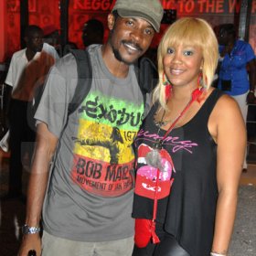 Janet Silvera/Gleaner Writer
Sumfest - From L- Female DJ Tifa and her agent Jerome Hamilton of Headline Entertainment pose for the camera outside the Jamaica Tourist Board booth at Reggae Sumfest 2K11 at Catherine Hall in Montego Bay last Friday night.