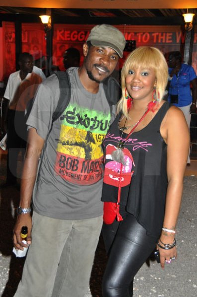 Janet Silvera/Gleaner Writer
Sumfest - From L- Female DJ Tifa and her agent Jerome Hamilton of Headline Entertainment pose for the camera outside the Jamaica Tourist Board booth at Reggae Sumfest 2K11 at Catherine Hall in Montego Bay last Friday night.