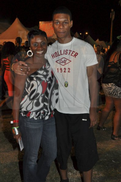 Janet Silvera/Staff Reporter
Sumfest - Olympian Juliet Cuthbert and her son Troy Ferguson pose for The Gleaner's camera at Reggae Sumfest 2K11 at Catherine Hall in Montego Bay last Friday night