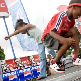 Anthony Minott/Freelance Photographer
Kids participating in a dance-off during the KFC-sponsored Digicel Rising Stars road show at the Portmore Mall, St. Catherine, last Saturday.