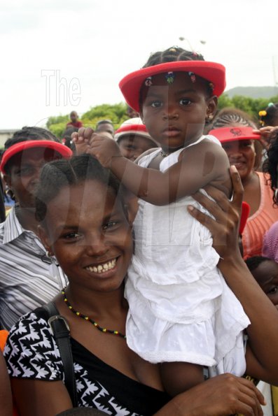 Anthony Minott/Freelance Photographer
A baby gets a front stage view of the action during the KFC-sponsored Digicel Rising Stars road show, featuring the top three contestants and departing fourth place winner, Moments at the Portmore Mall, on Saturday, August 29, 2009.