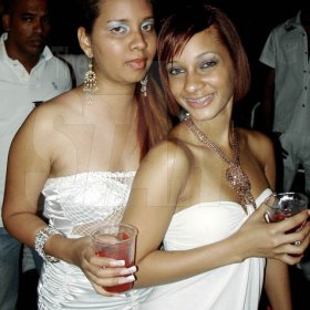 Contributed
Suzanne Wong (left) and?Crystal Morales are picture perfect in all white during the Red Stripe Renaissance Christmas Eve party at the Palisadoes Go-Kart Track.
?