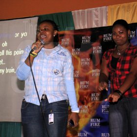 Anthony Minott/Freelance Photographer
Nastassie (left), and Patrice offered some laugh to patrons with their version of hit tune Grenade during RumFire sponsored Miles Karaoke at the Portmore Mall, on Saturday, July 14, 2012.