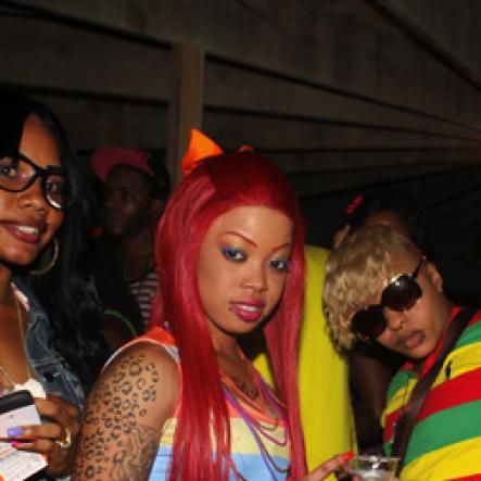 Anthony Minott/Freelance Photographer
Girls pose for a photo during Rumbar Chug it Sugarman's Beach, Hellshire in Portmore, St Catherine on Sunday, September 16, 2012.