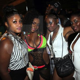 Anthony Minott/Freelance Photographer 
These ladies share the party vibe during Rumbar Chug it Sugarman's Beach, Hellshire in Portmore, St Catherine on Sunday, September 16, 2012.