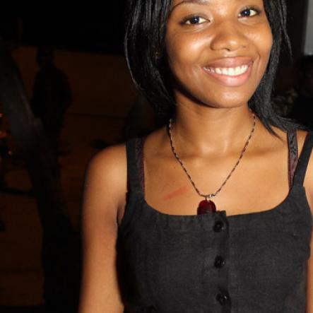 Anthony Minott/Freelance Photographer
A pretty young lady flashes a smile during Rumbar Chug it party held at Sugarman's Beach, in Hellshire, last Sunday.