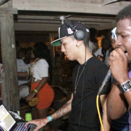 Anthony Minott/Freelance Photographer
Disc jock, Creep (left- in cap) from Chromatic Sound and another selector brought the musical vibes during Chug it...the Soca Edition at Sugar Man's Beach, Hellshire, Portmore, St Catherine on Sunday, March 18, 2012. Over 8,000 patrons, mainly youngsters came to party.